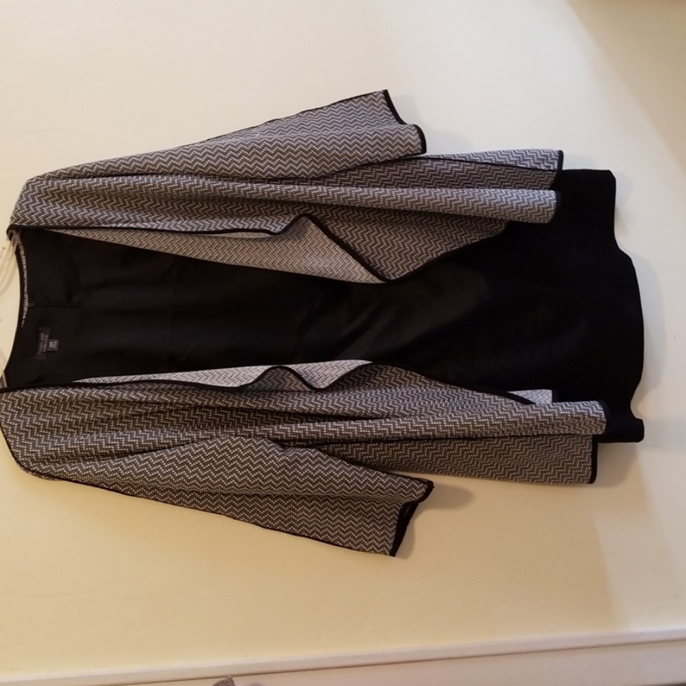 Sleeveless black dress with reversible jacket